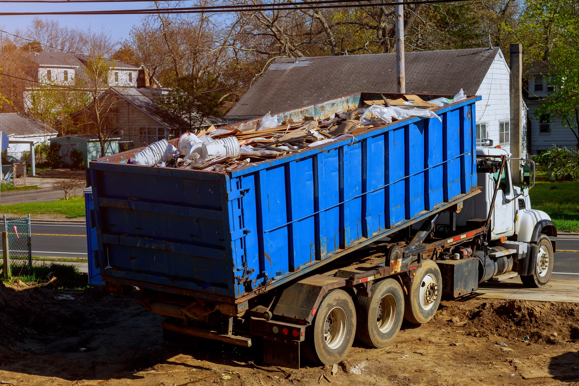 Recycling container trash dumpsters being full with garbage